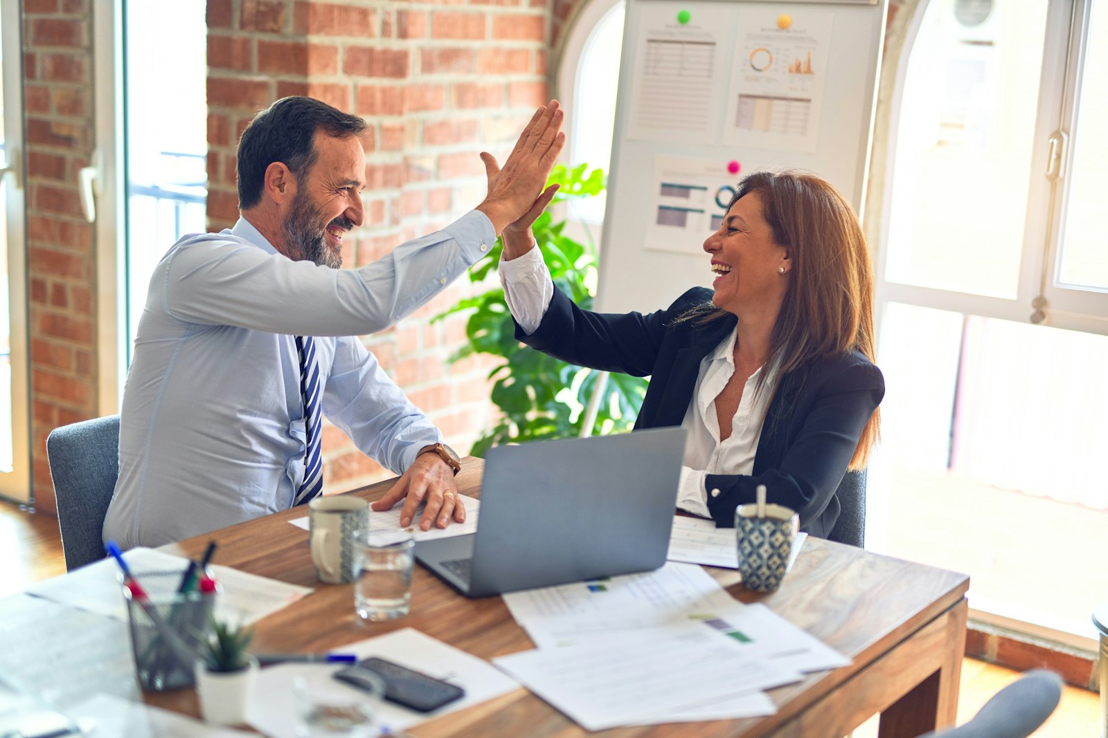 Real estate professionals reviewing a file together
